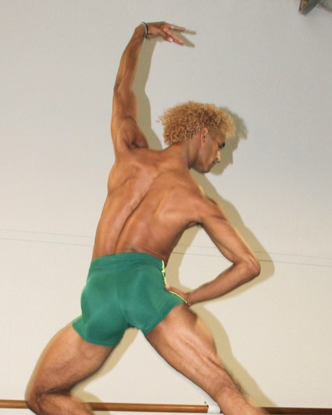 Davi Ramos wearing GENTS Brazil Collection 1/4 shorts close up leap