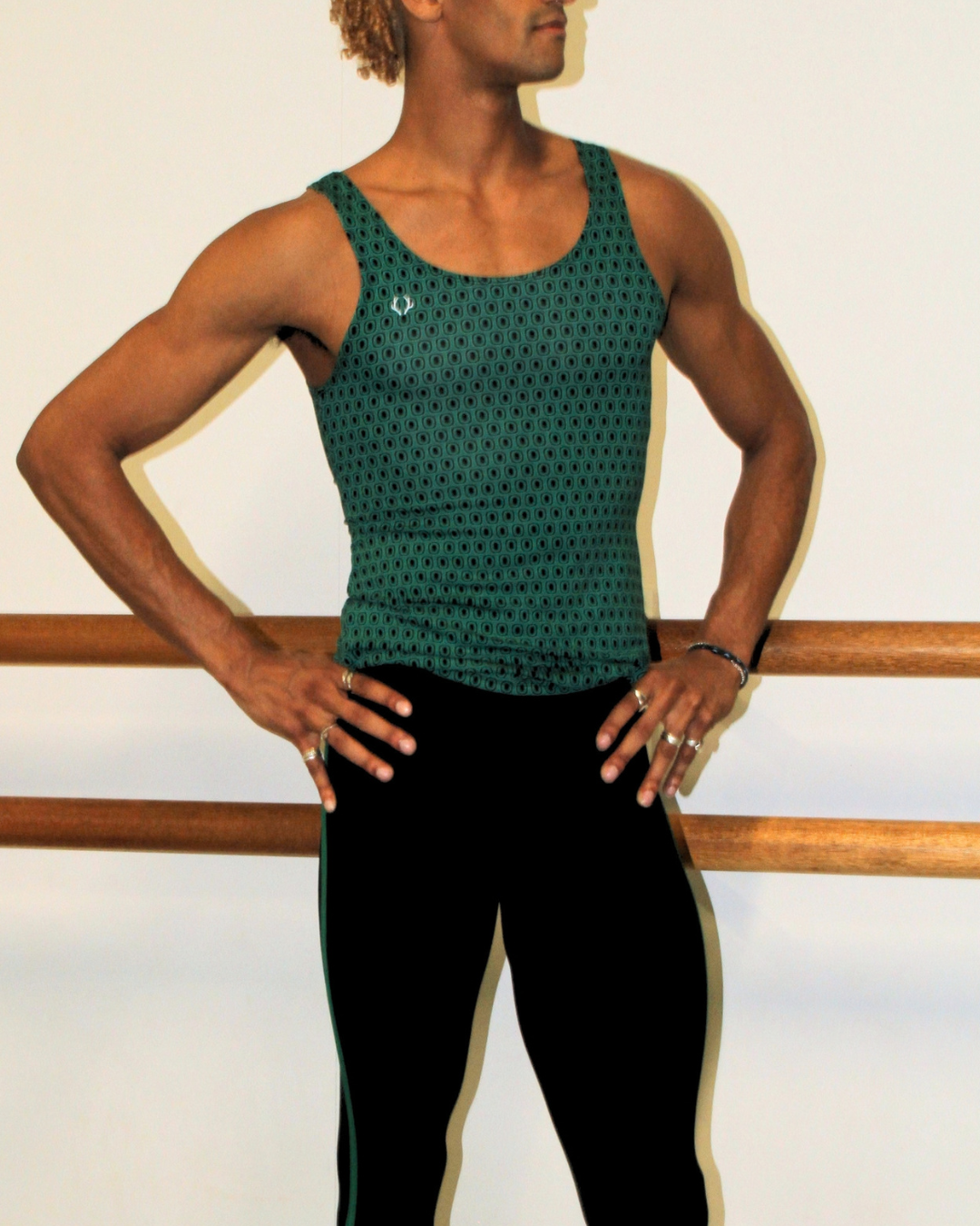 Davi Ramos wearing GENTS forest green print singlet in the studio side profile
